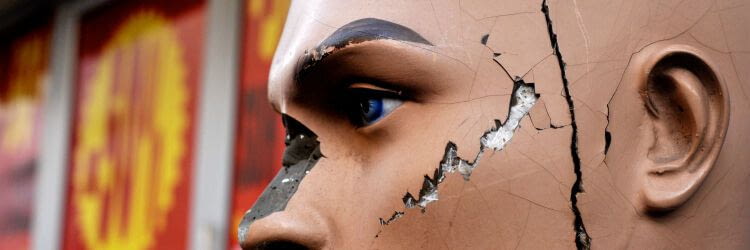 Rue du Faubourg du Temple, in Paris: one old broken mannequin face, in front of a clothes shop. The quarter is particularly living, cheep and popular. See on Flickr